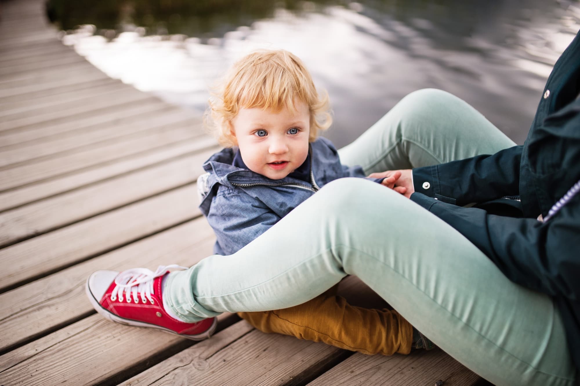 Senior woman with little boy at the lake.